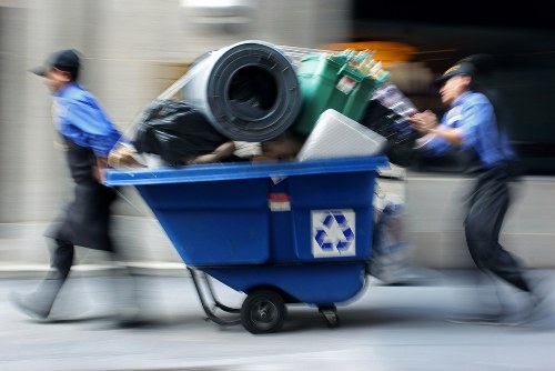 Low-emission van unloading electronics at a transfer station for recycling